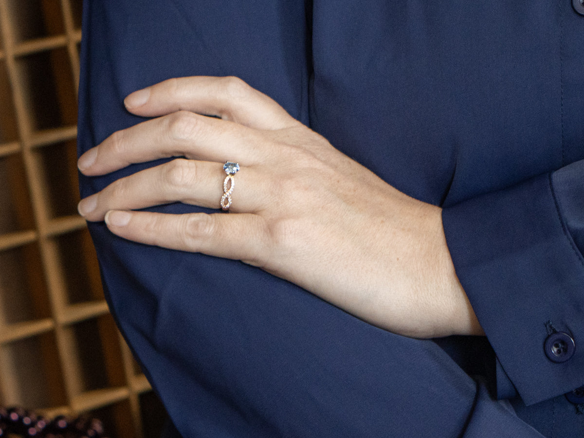 Modern Sapphire and Twisting Diamond Engagement Ring