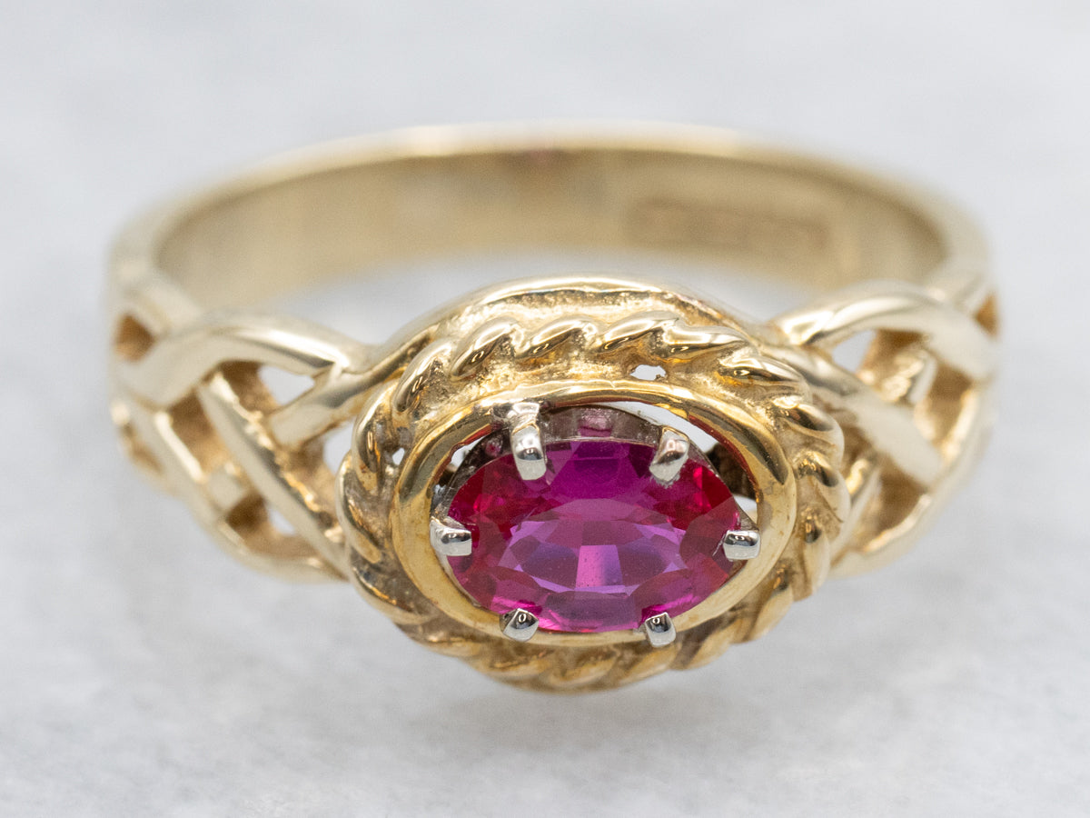 Unique Twisting Ruby Solitaire Ring with Openwork Knot Shoulders