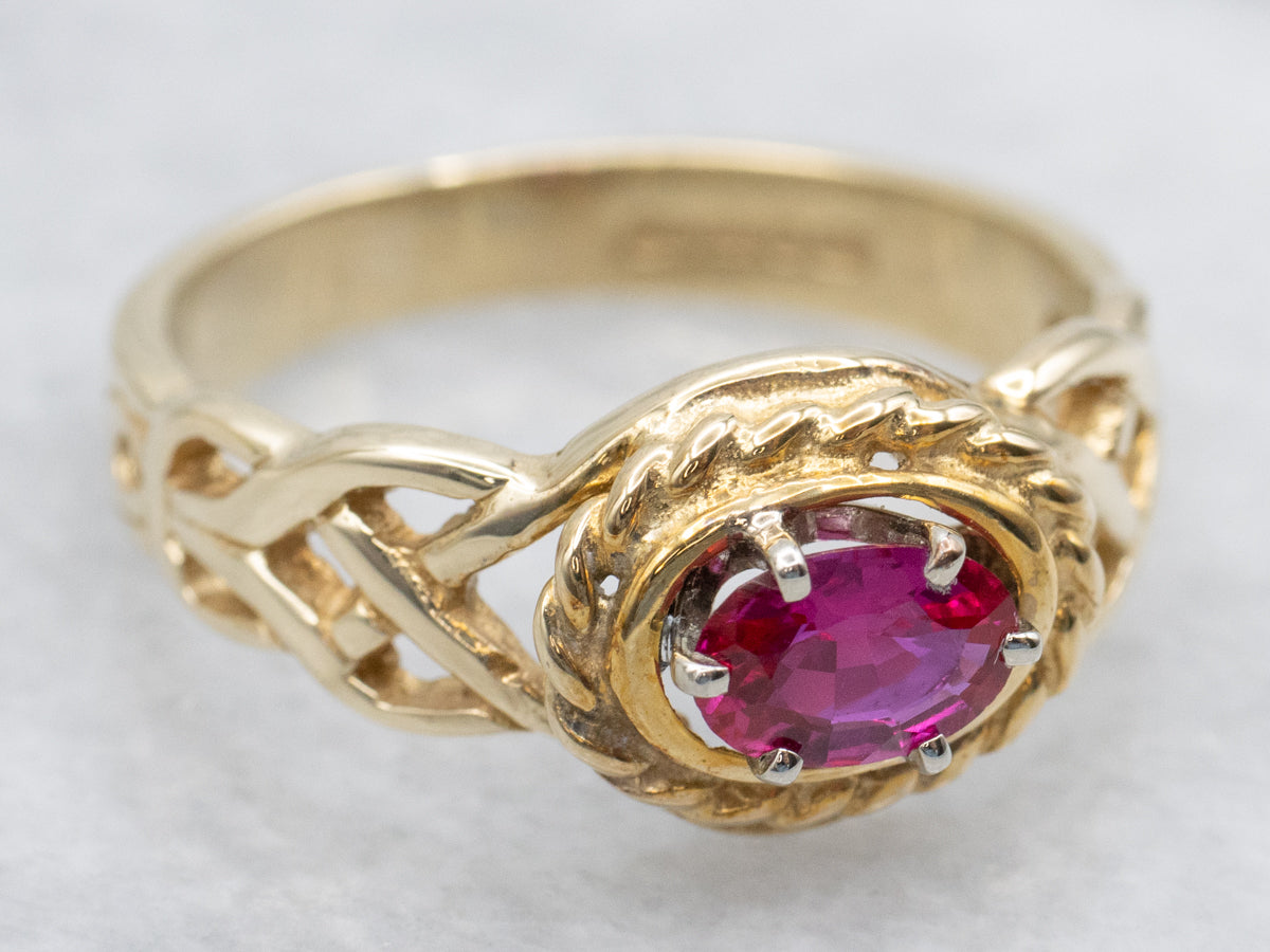 Unique Twisting Ruby Solitaire Ring with Openwork Knot Shoulders