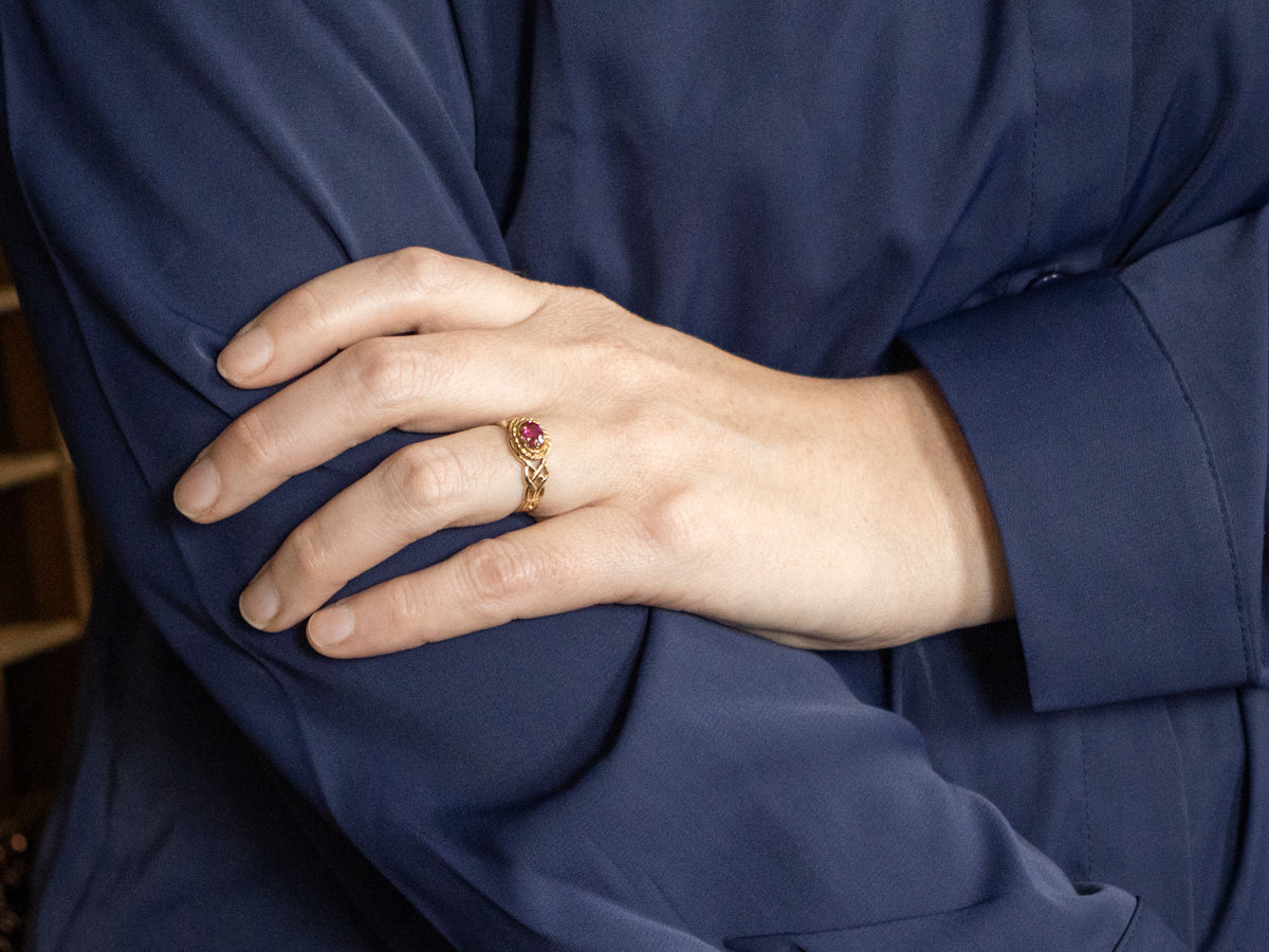 Unique Twisting Ruby Solitaire Ring with Openwork Knot Shoulders