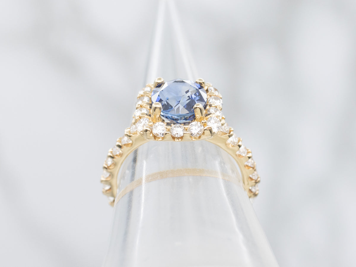 Modern Sapphire and Gold Halo Ring