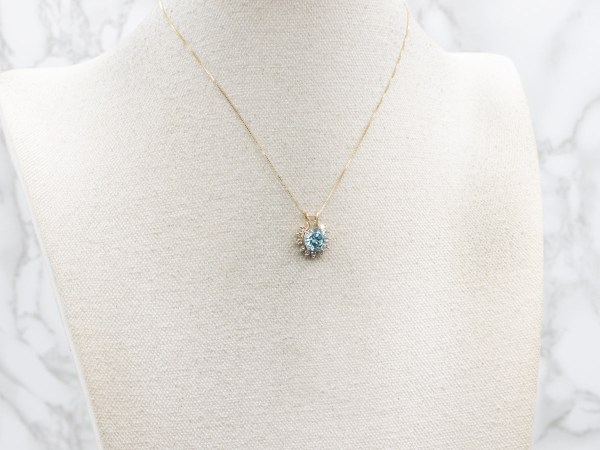 Icy Blue Zircon and Diamond Halo Pendant