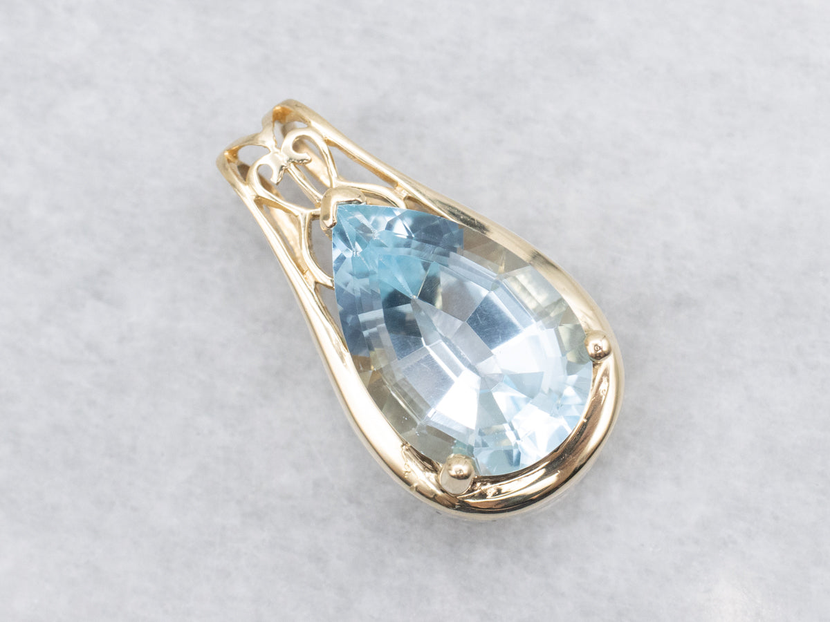 Pear Cut Blue Topaz and Gold Pendant