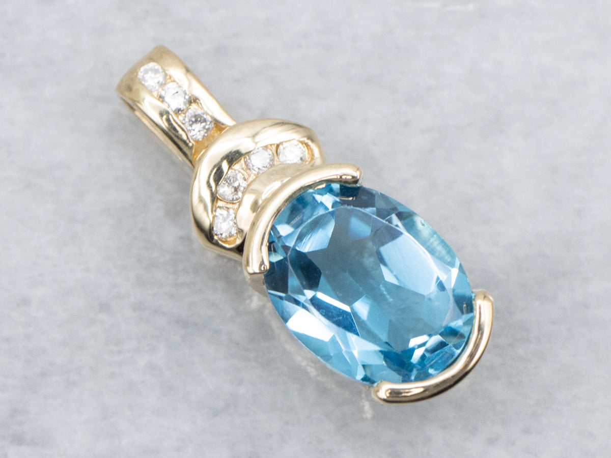 Modern Gold Blue Topaz and Diamond Pendant