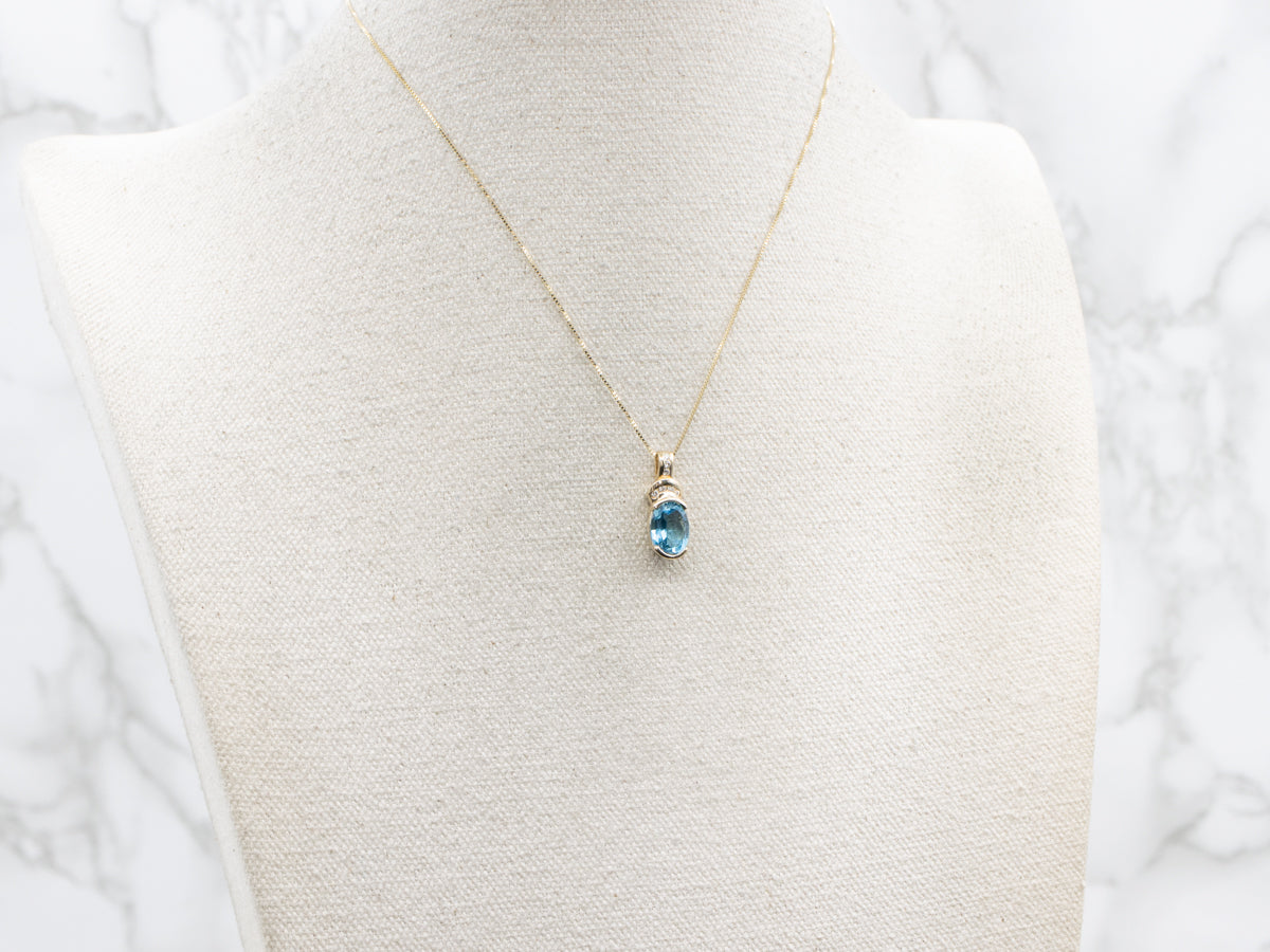 Modern Gold Blue Topaz and Diamond Pendant