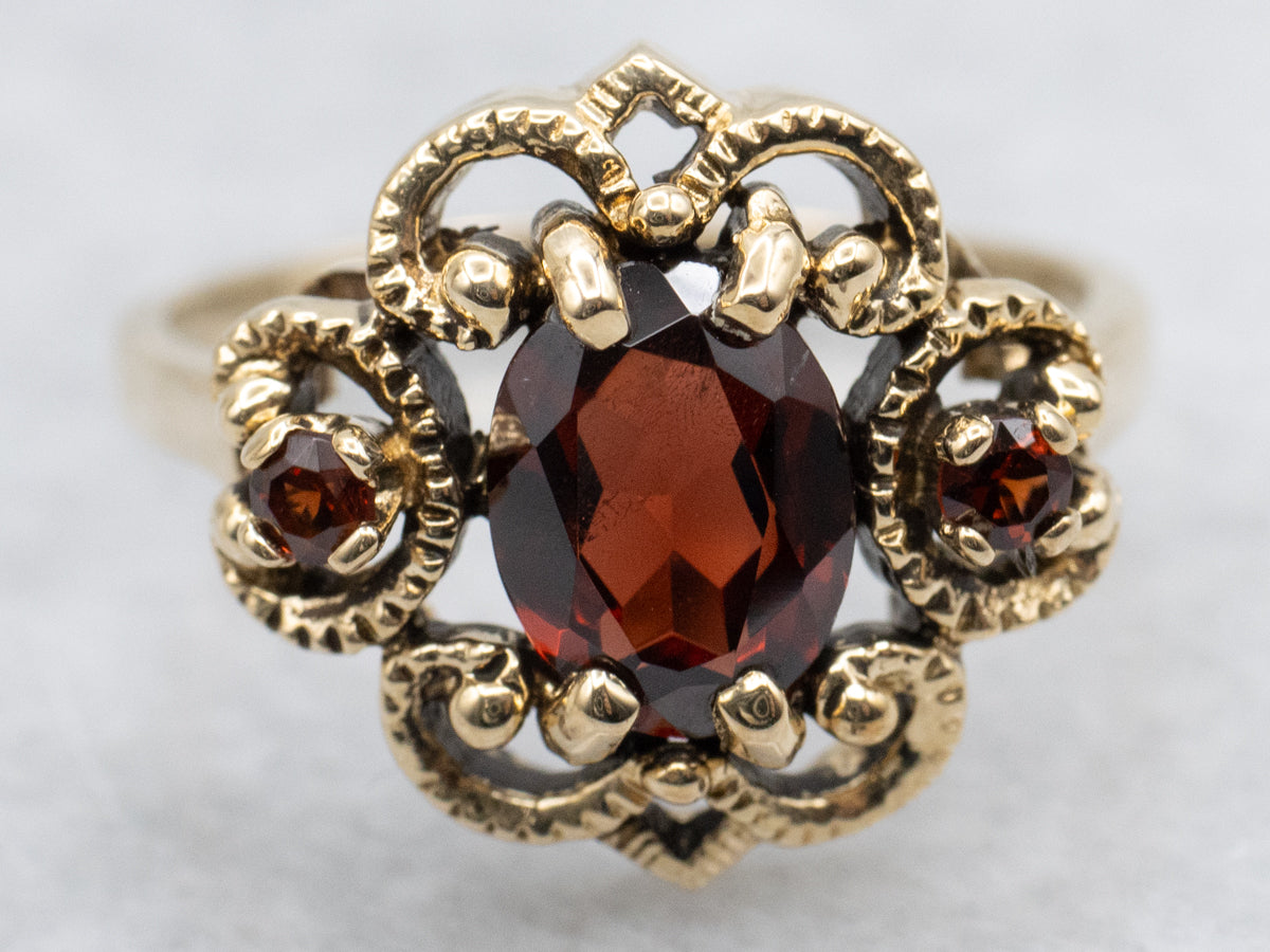 Ornate Twisting Gold Garnet Ring