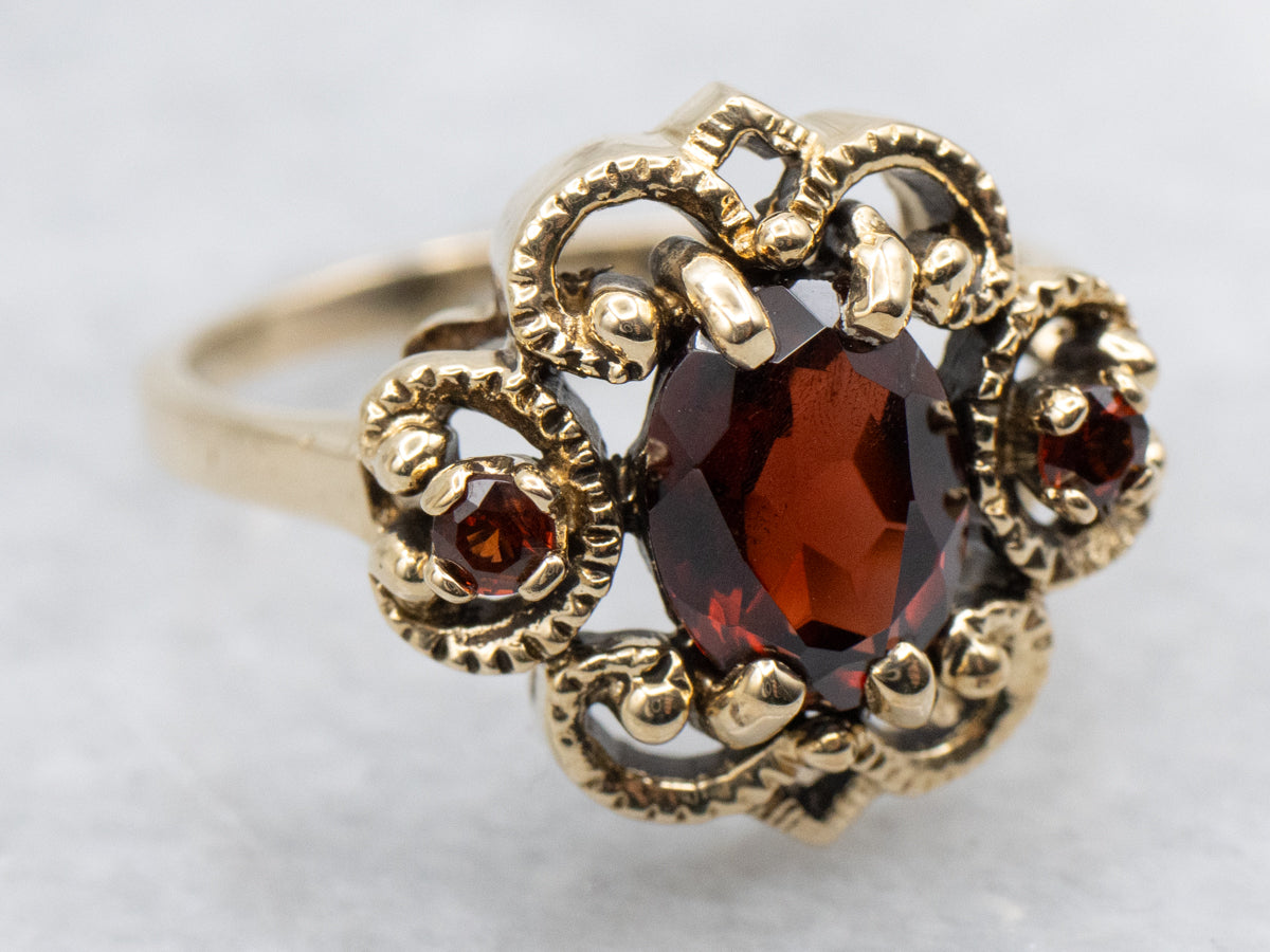 Ornate Twisting Gold Garnet Ring