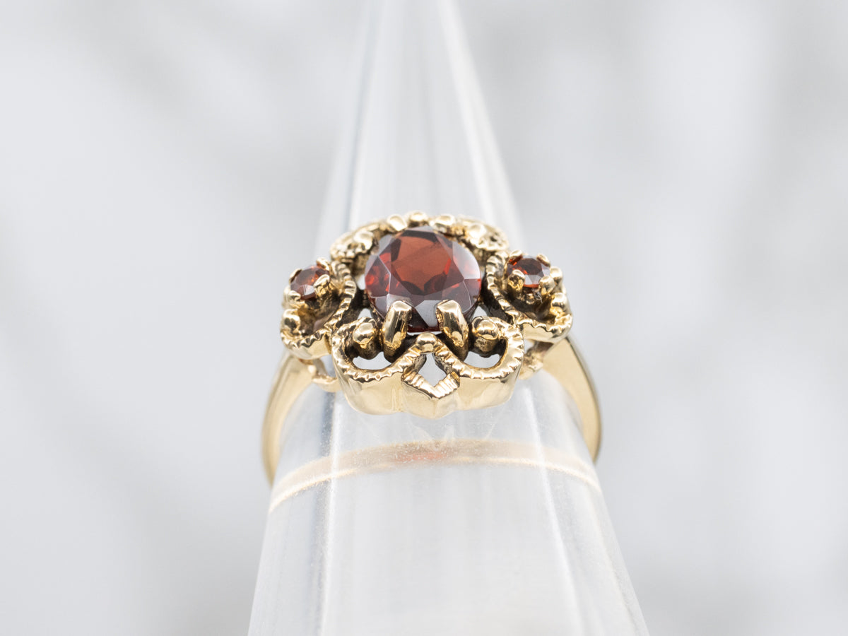Ornate Twisting Gold Garnet Ring