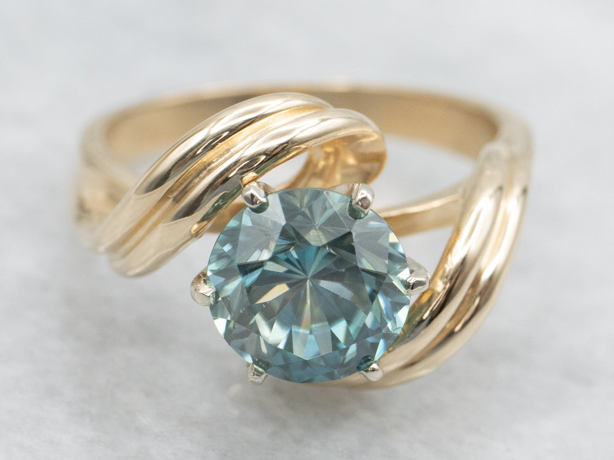 Twisting Gold Blue Zircon Bypass Ring