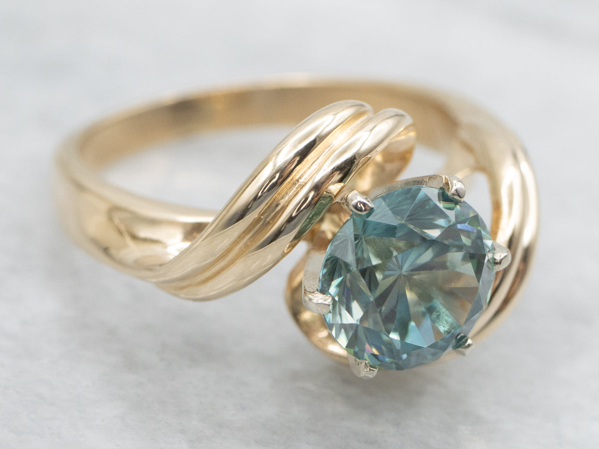 Twisting Gold Blue Zircon Bypass Ring