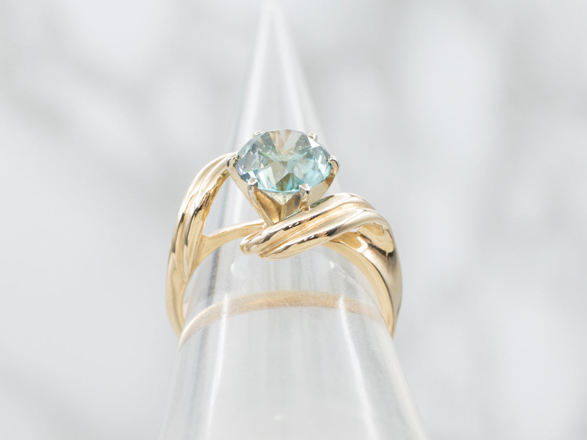Twisting Gold Blue Zircon Bypass Ring