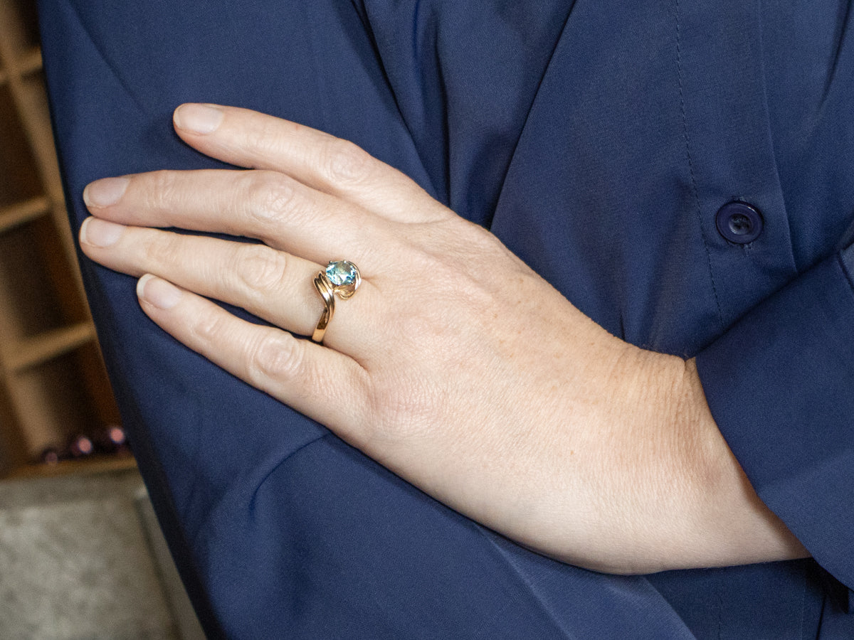 Twisting Gold Blue Zircon Bypass Ring