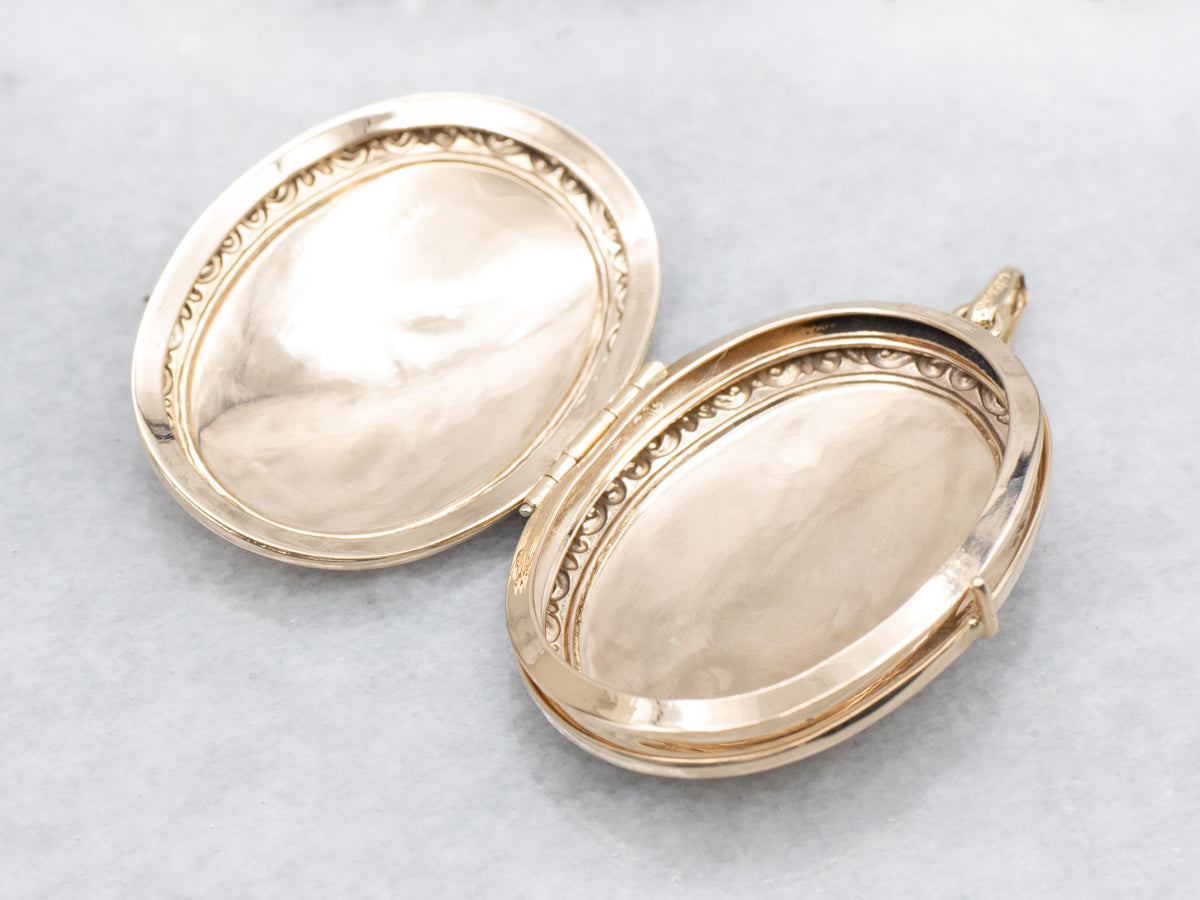 Engraved Gold Oval Locket with Patterned Edges