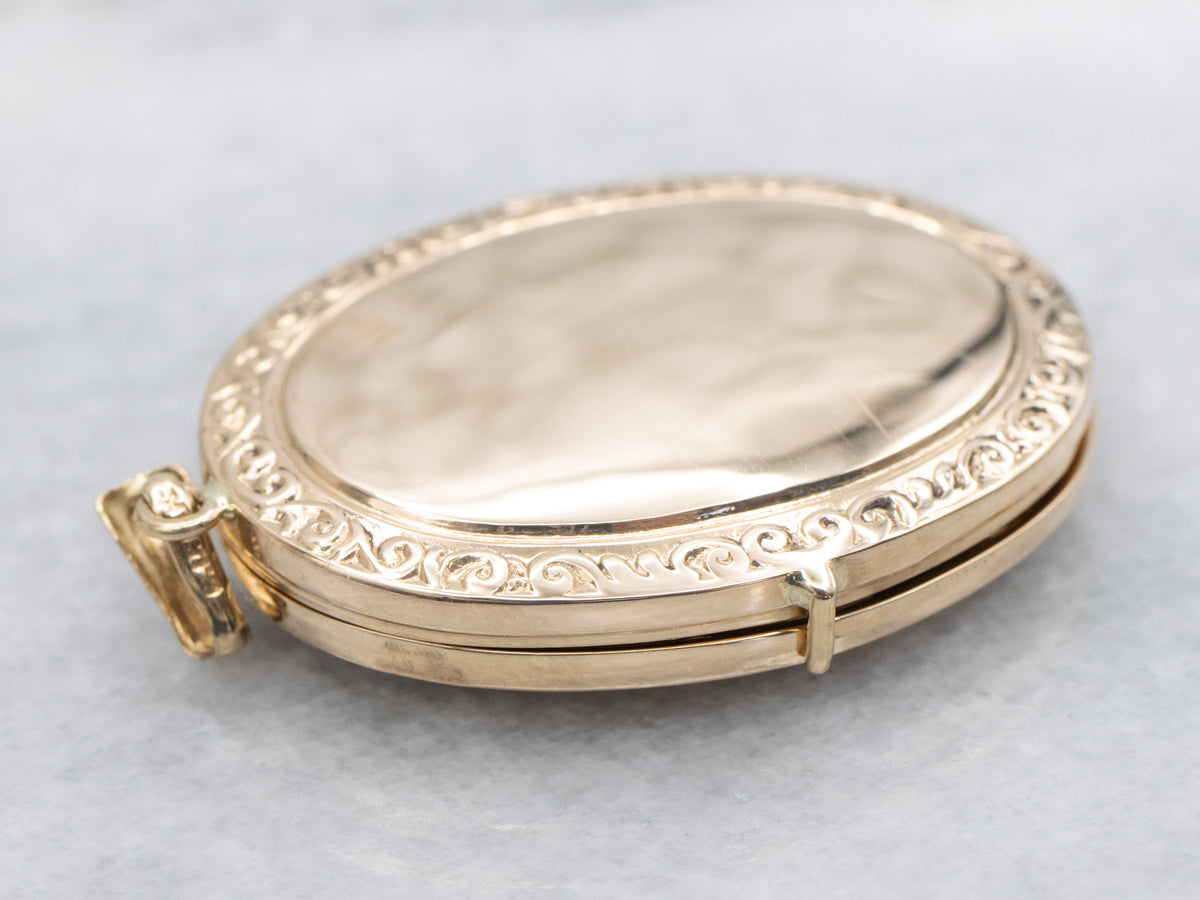 Engraved Gold Oval Locket with Patterned Edges
