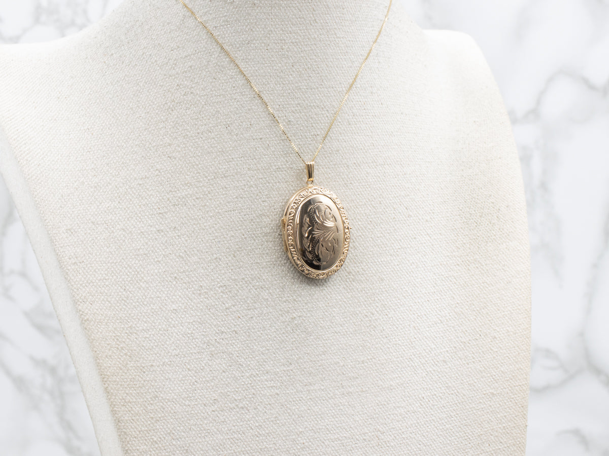 Engraved Gold Oval Locket with Patterned Edges