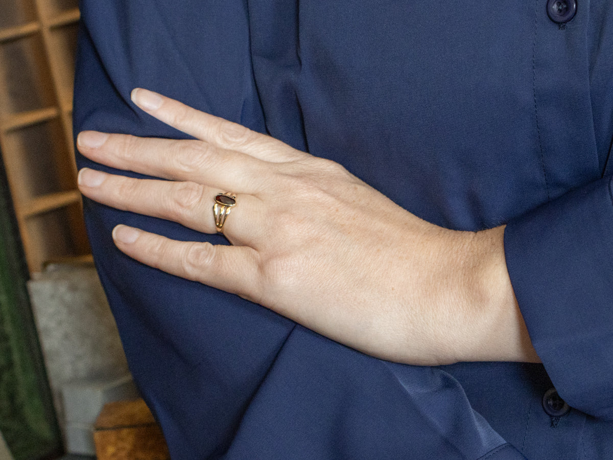 Bezel Set Garnet and Split Shank Gold Ring