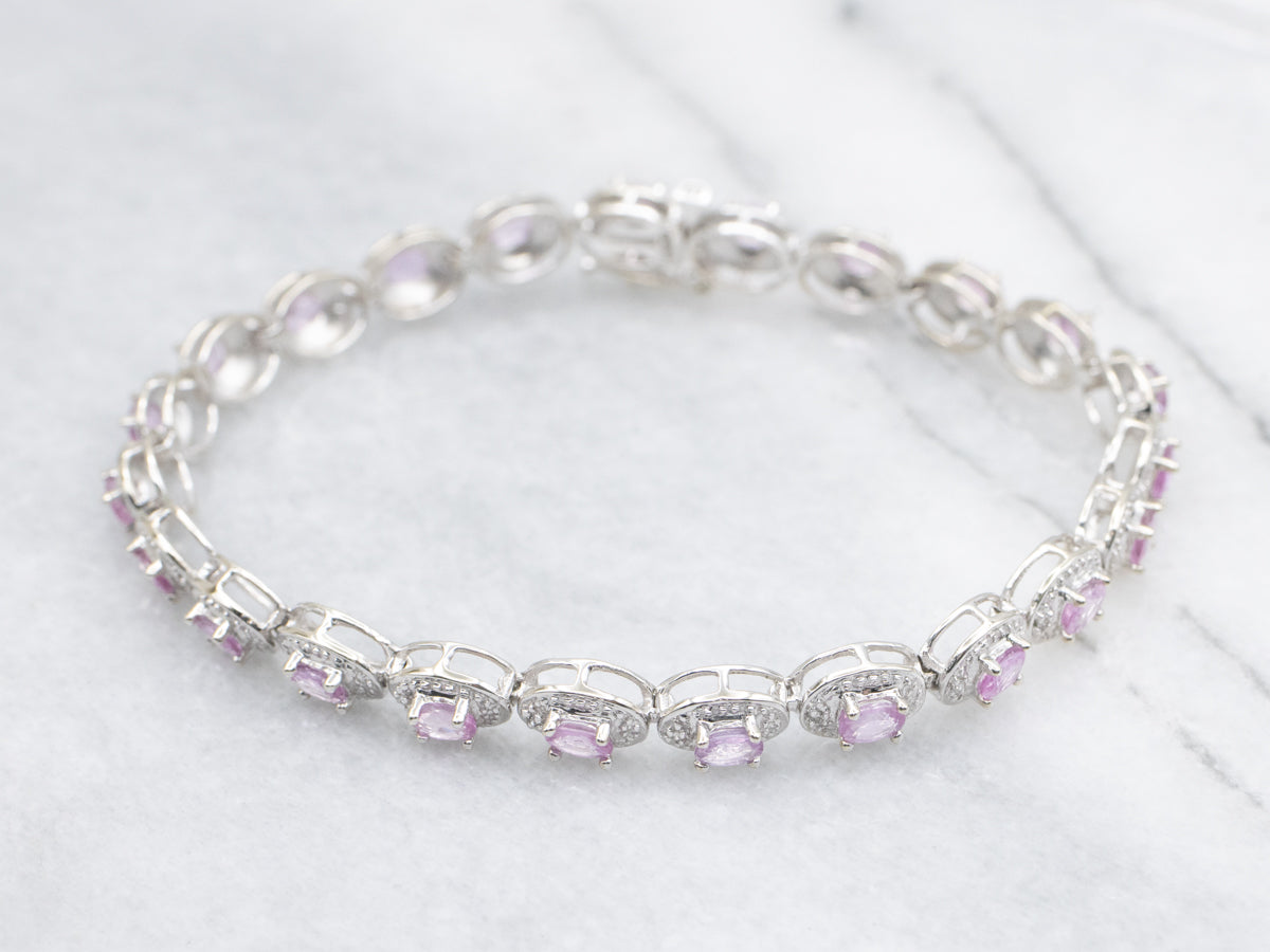 Modern Pink Sapphire and Diamond Halo White Gold Bracelet