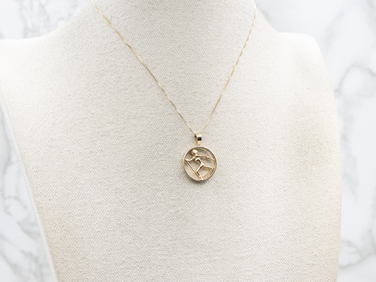 Round Yellow Gold Cross-Country Skiing Pendant