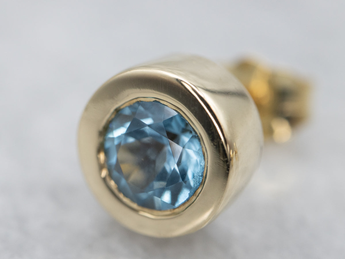 Bezel Set Blue Topaz Gold Stud Earrings