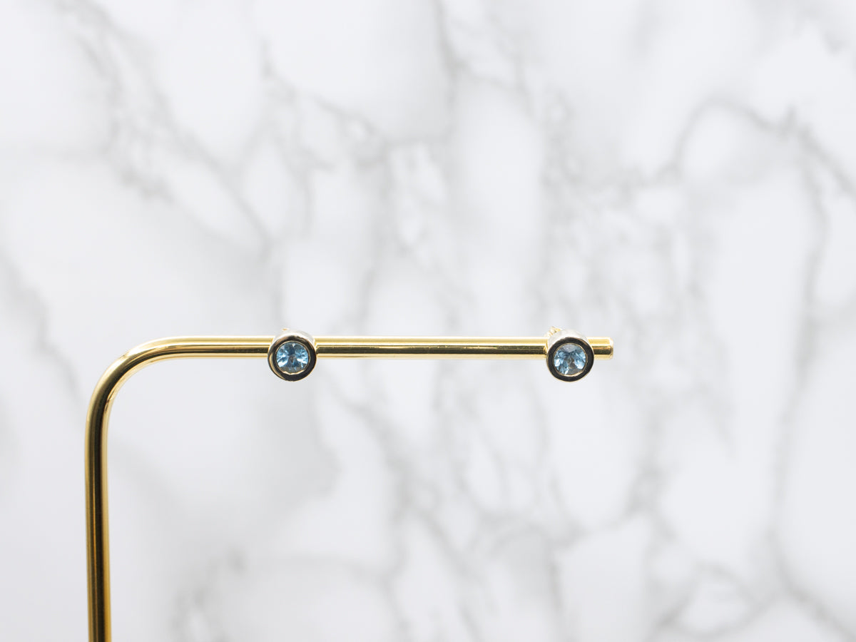 Bezel Set Blue Topaz Gold Stud Earrings