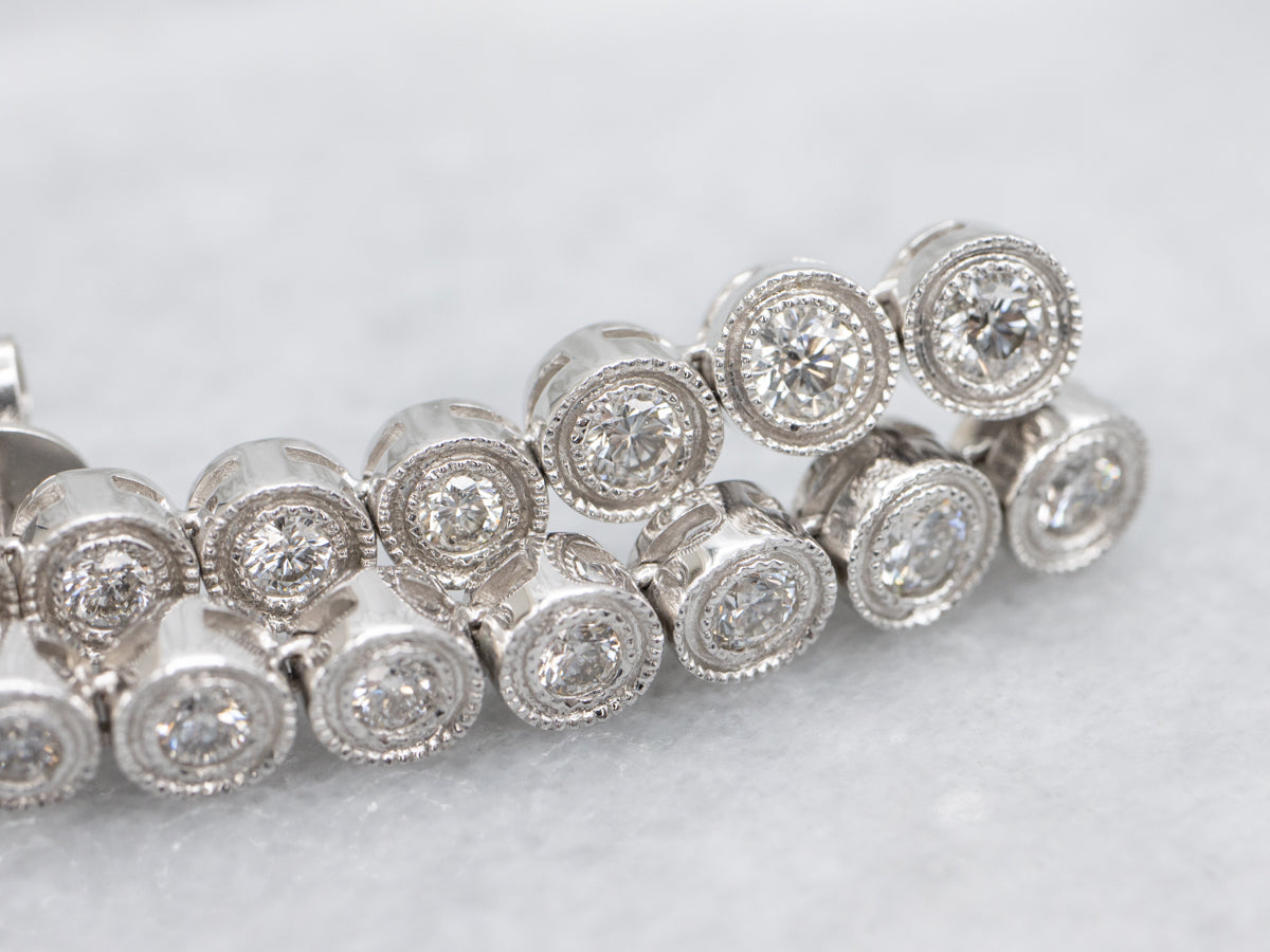 Bezel Set Graduated Diamond White Gold Drop Earrings