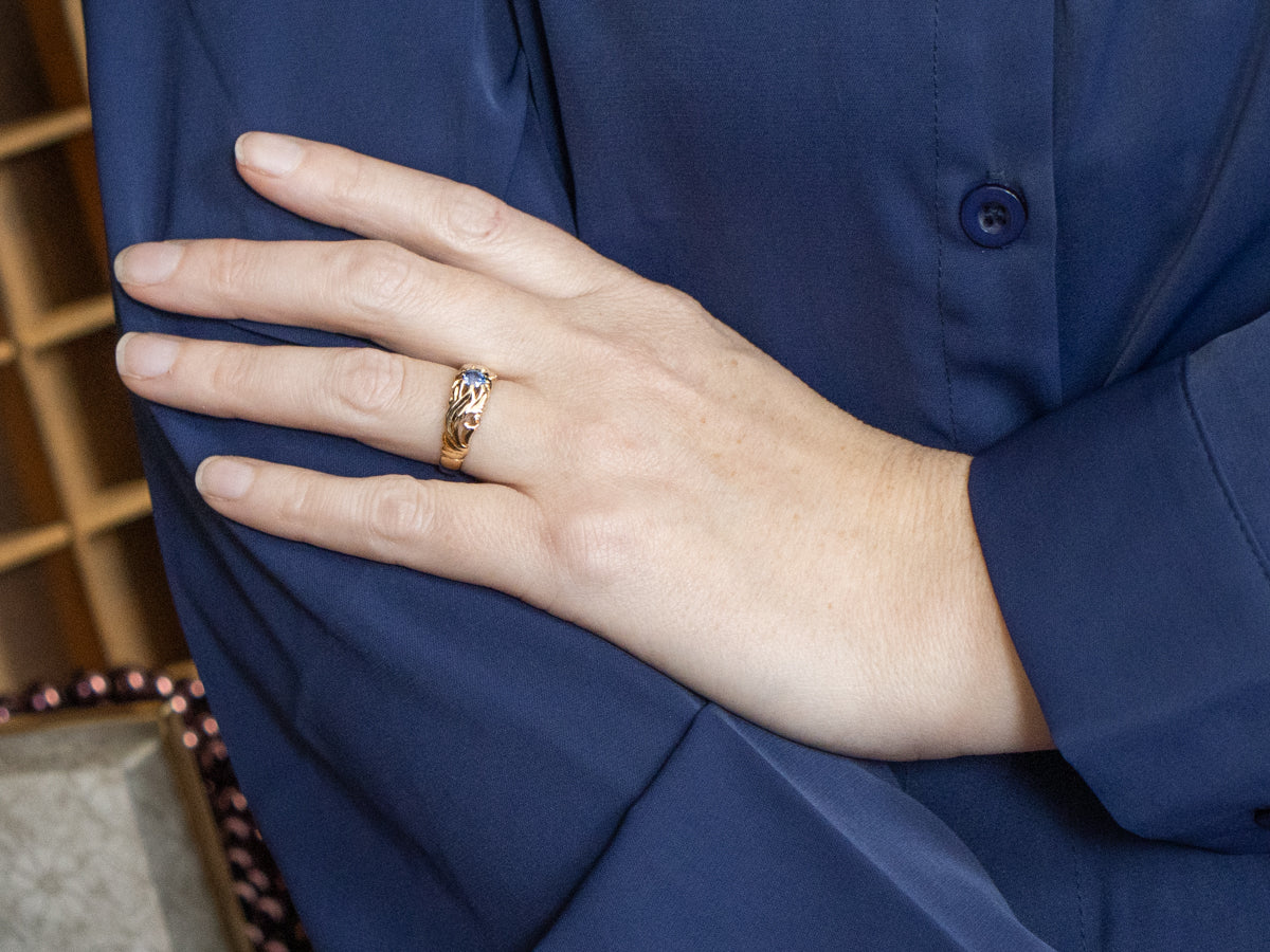 Scrolling 1920s Carved Belcher-Set Sapphire Solitaire Ring