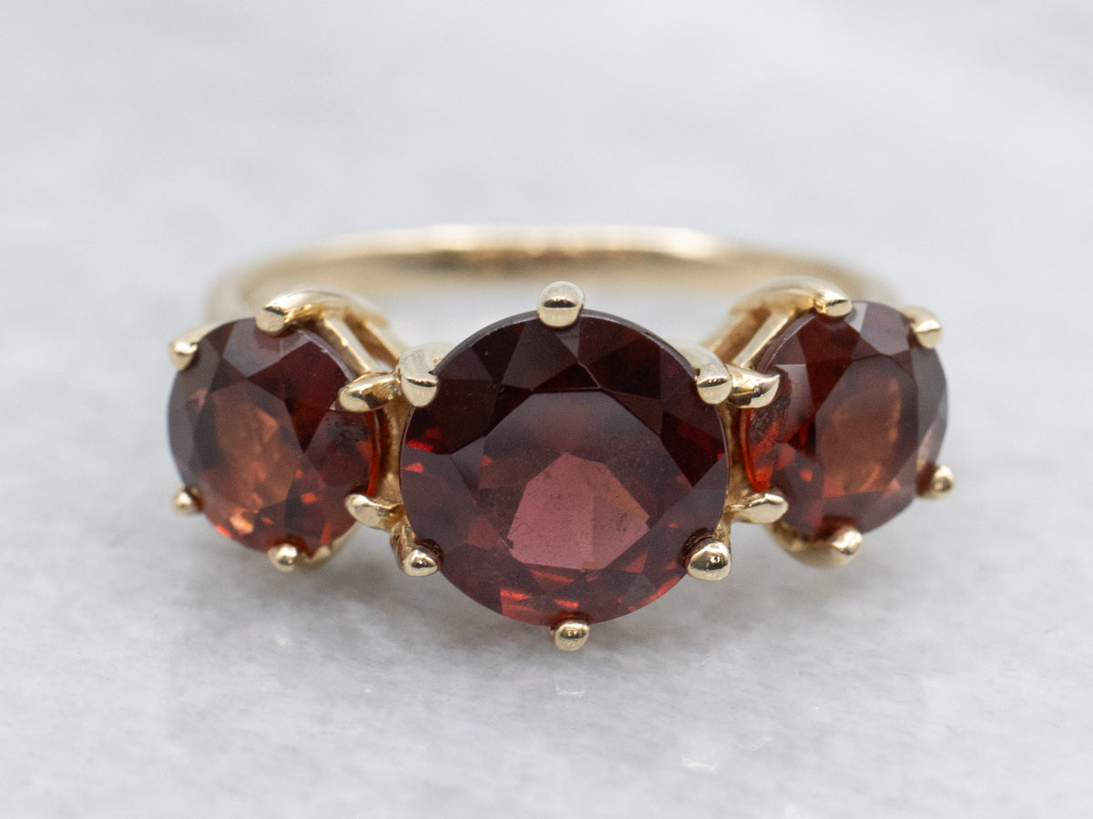 Three Stone Garnet and Gold Ring Ring