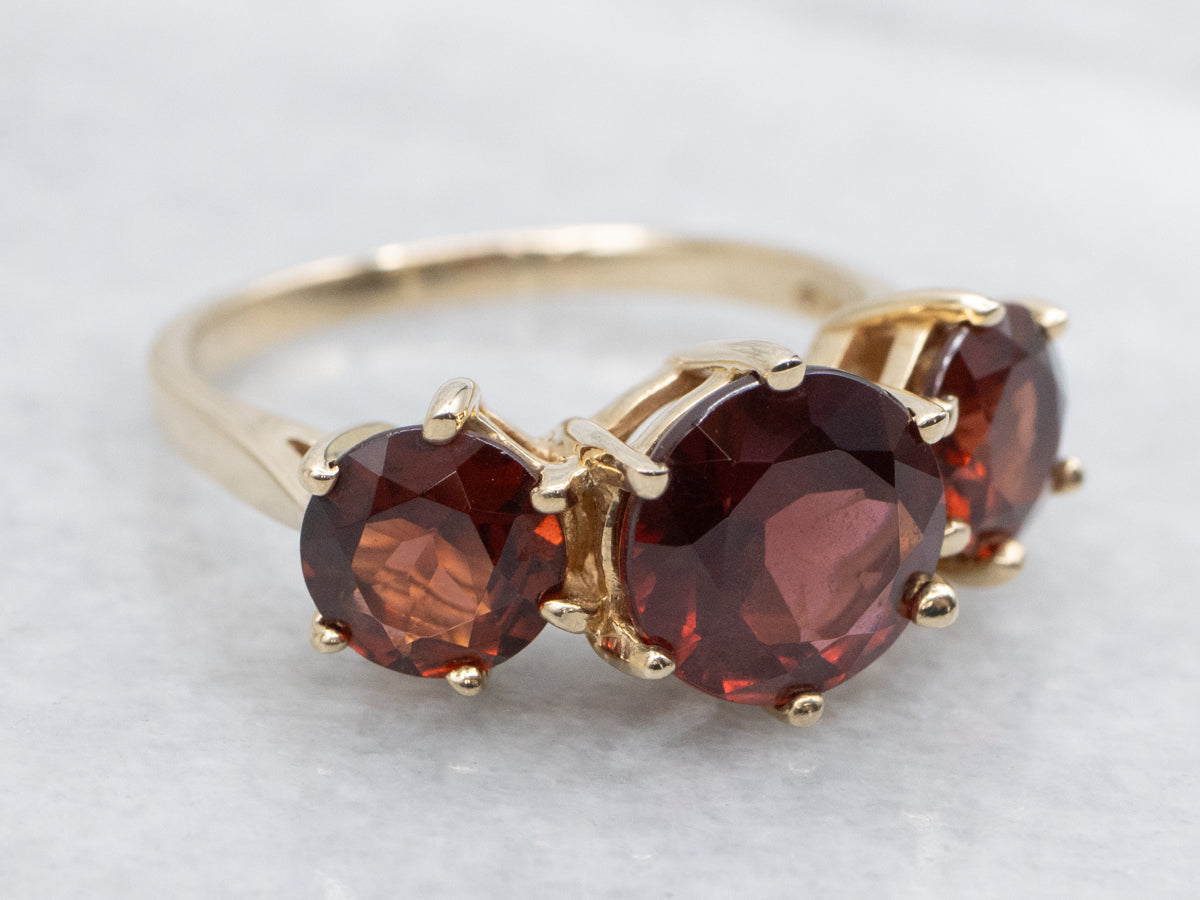 Three Stone Garnet and Gold Ring Ring