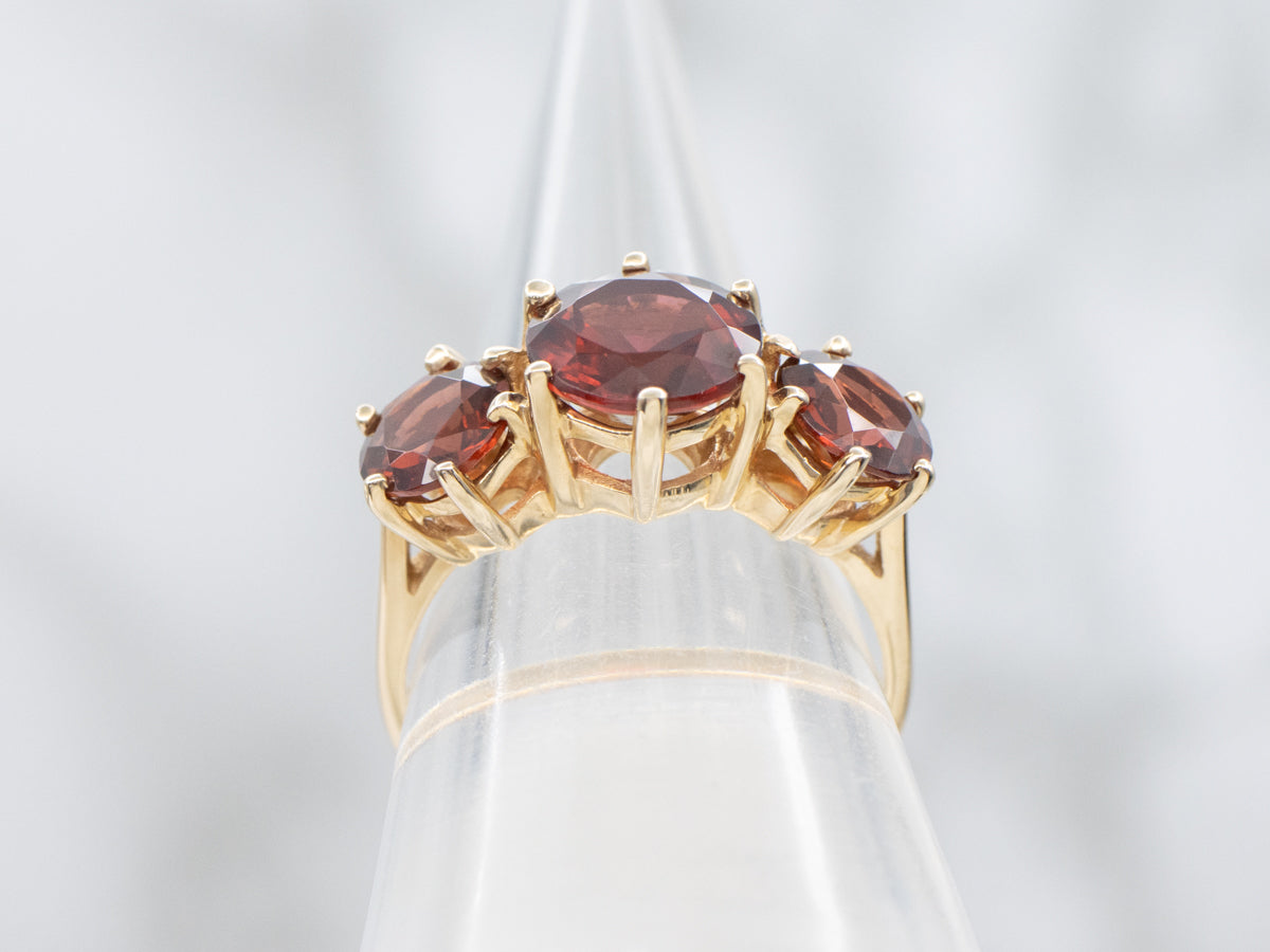 Three Stone Garnet and Gold Ring Ring