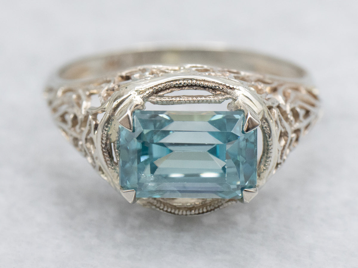 East to West Emerald Cut Blue Zircon Gold Filigree Ring