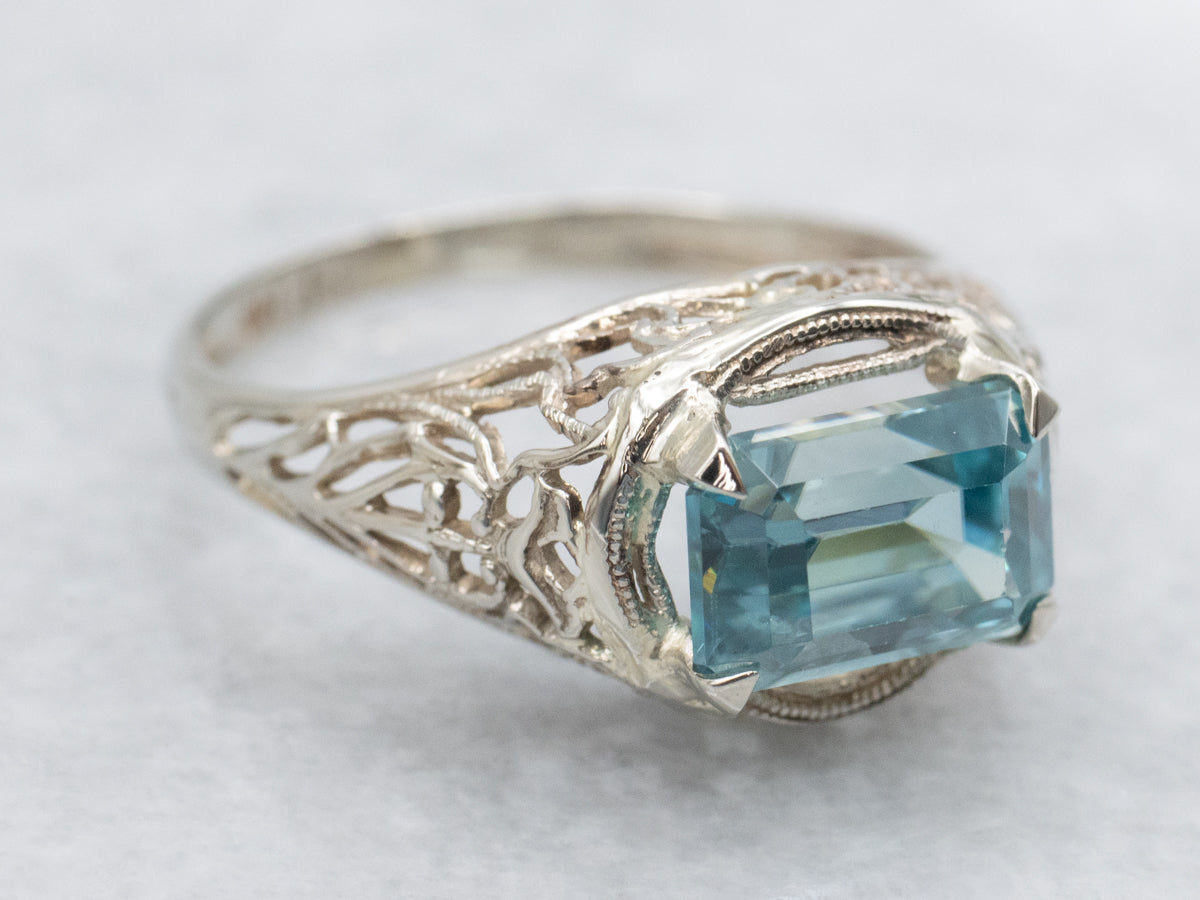 East to West Emerald Cut Blue Zircon Gold Filigree Ring