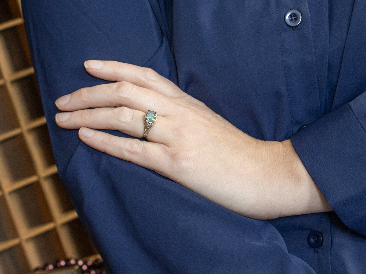 East to West Emerald Cut Blue Zircon Gold Filigree Ring