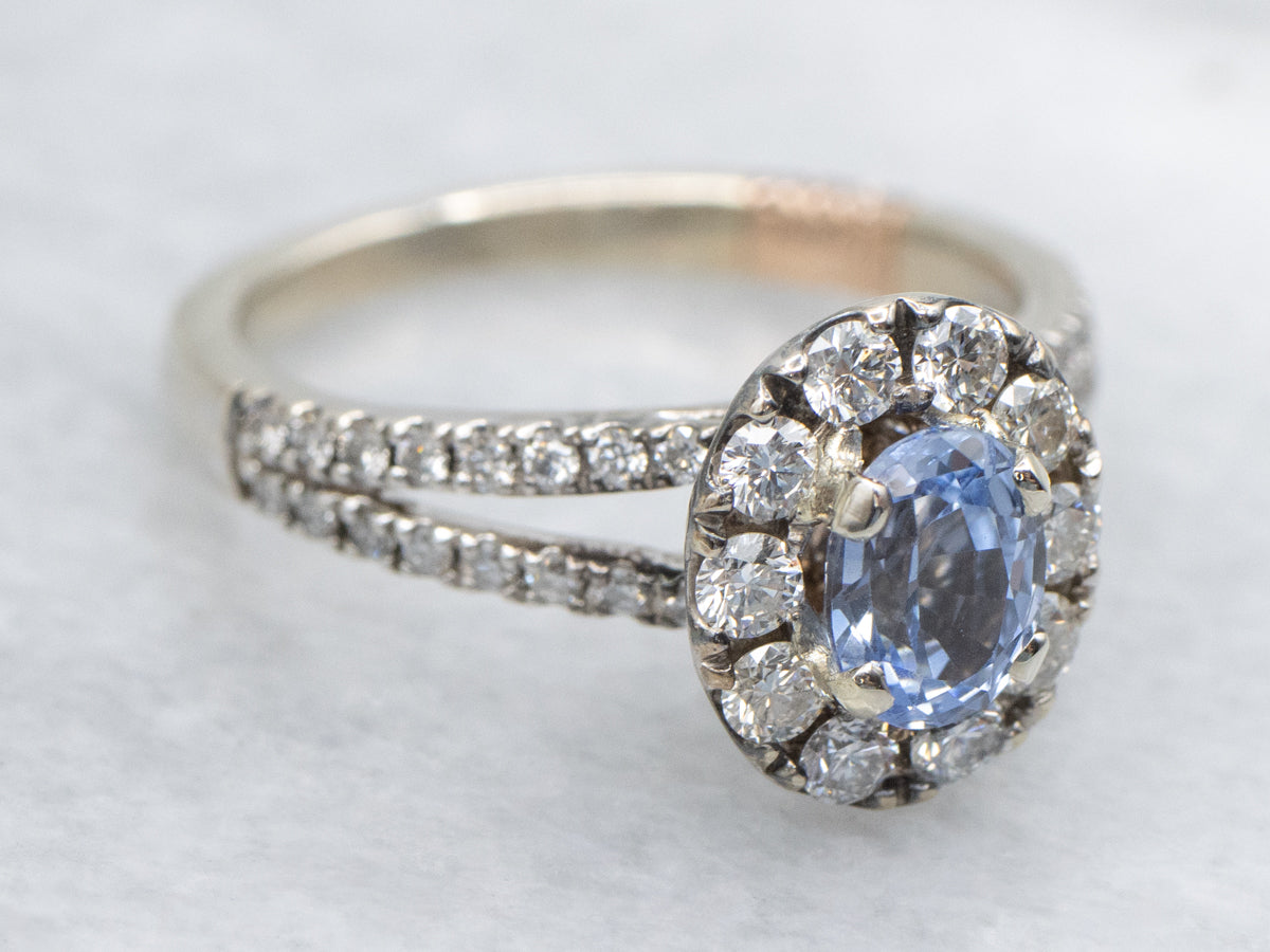 Pretty Sapphire and Diamond Halo Engagement Ring