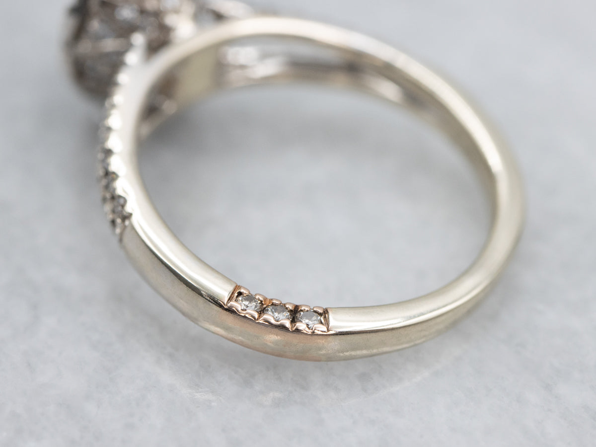 Pretty Sapphire and Diamond Halo Engagement Ring