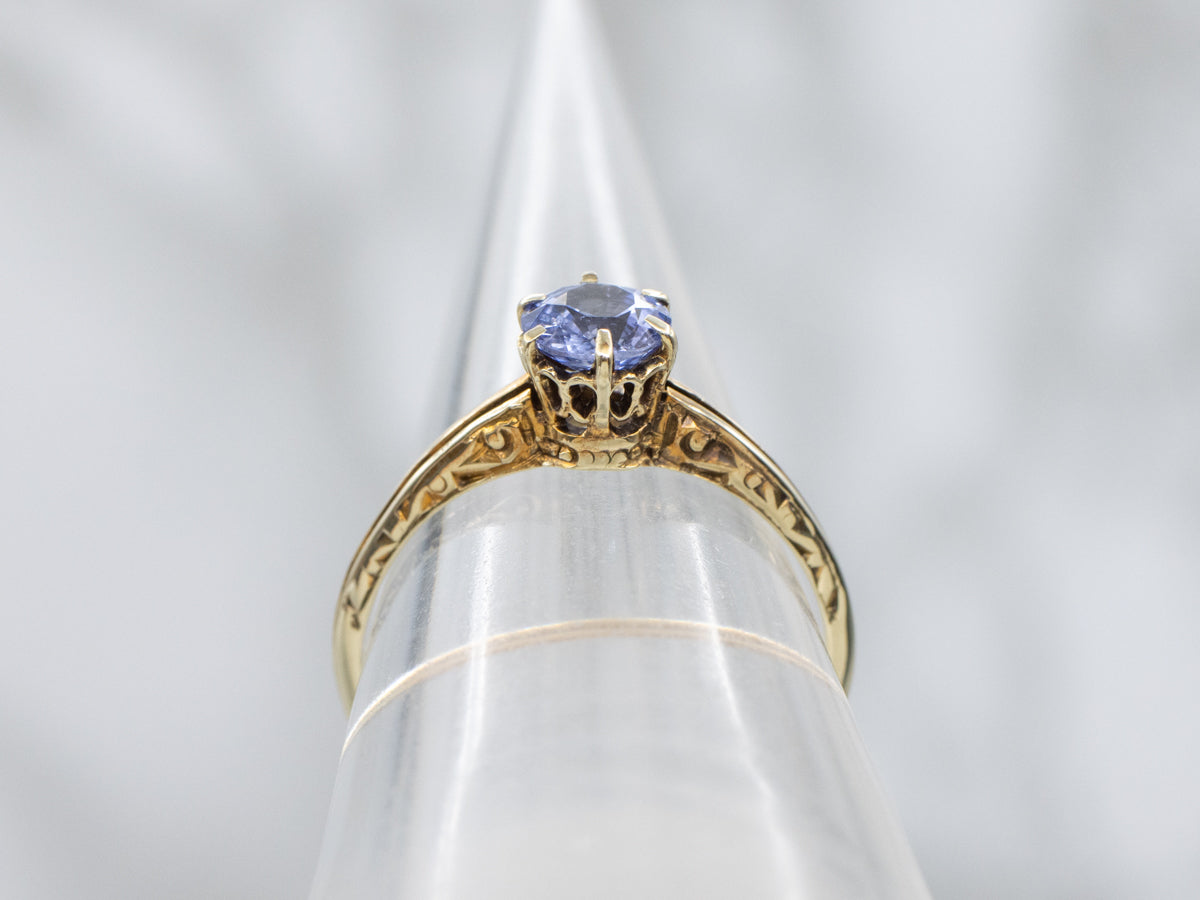Beautiful Sapphire Solitaire in Scrolling Engraved Gold Setting