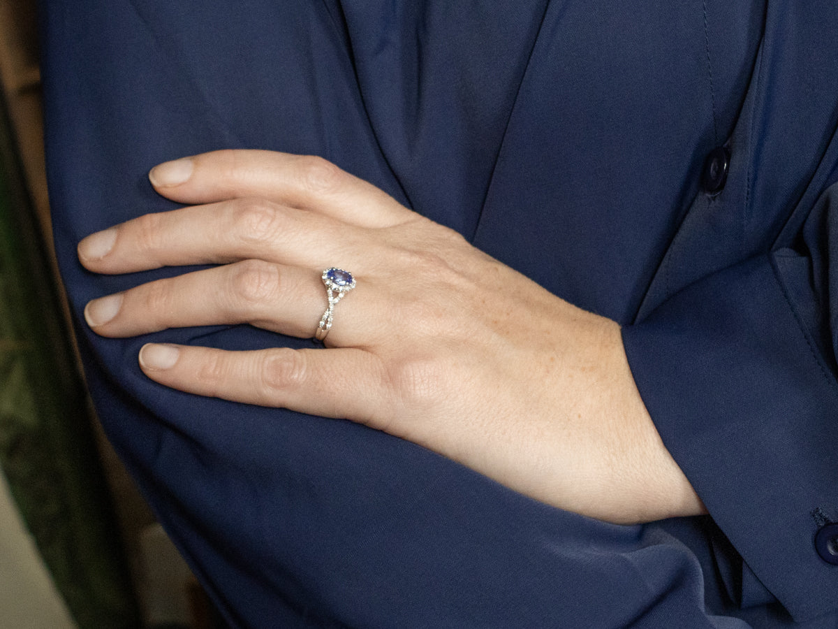 White Gold Twisting Tanzanite and Diamond Halo Ring