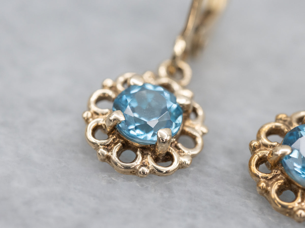 Sparkling Blue Topaz Yellow Gold Drop Earrings