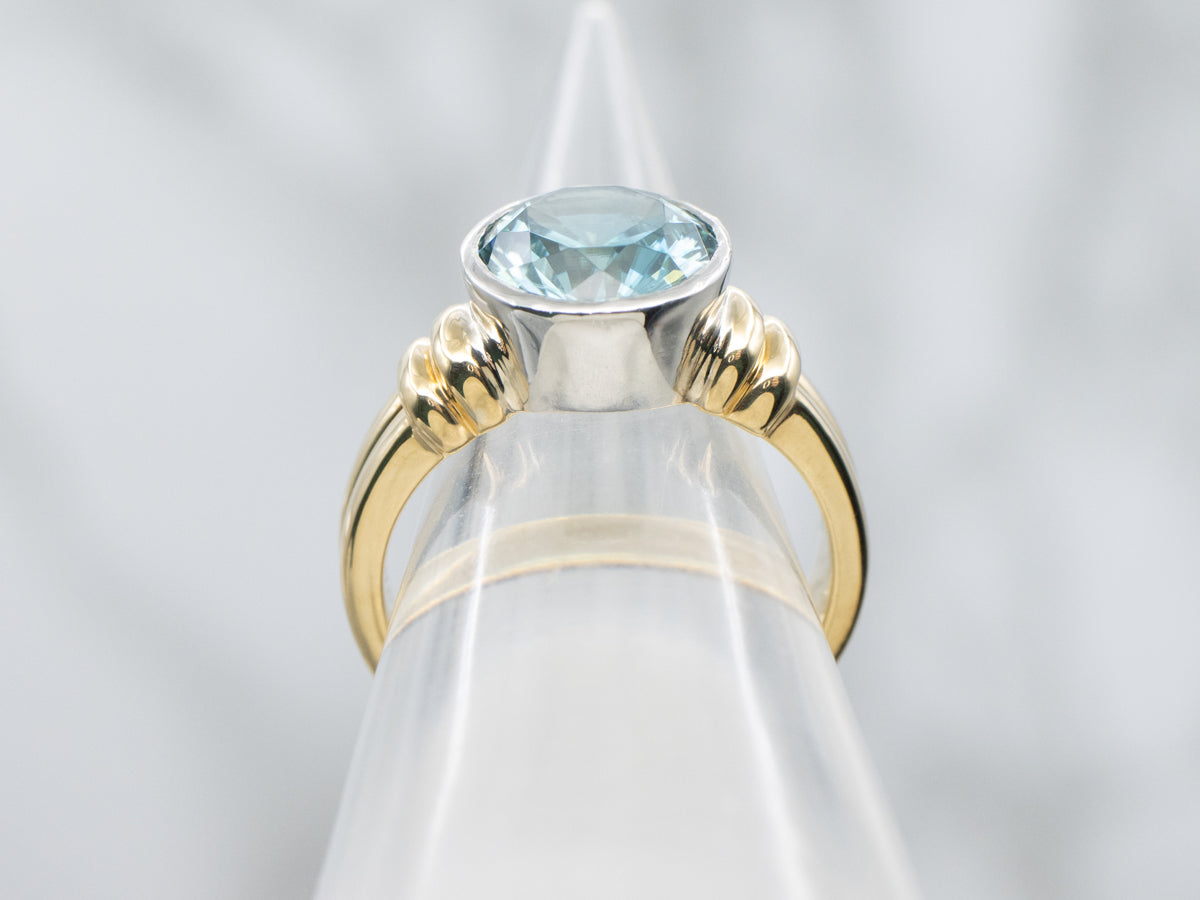 Modern Bezel-Set Platinum and Gold Blue Zircon Solitaire Ring