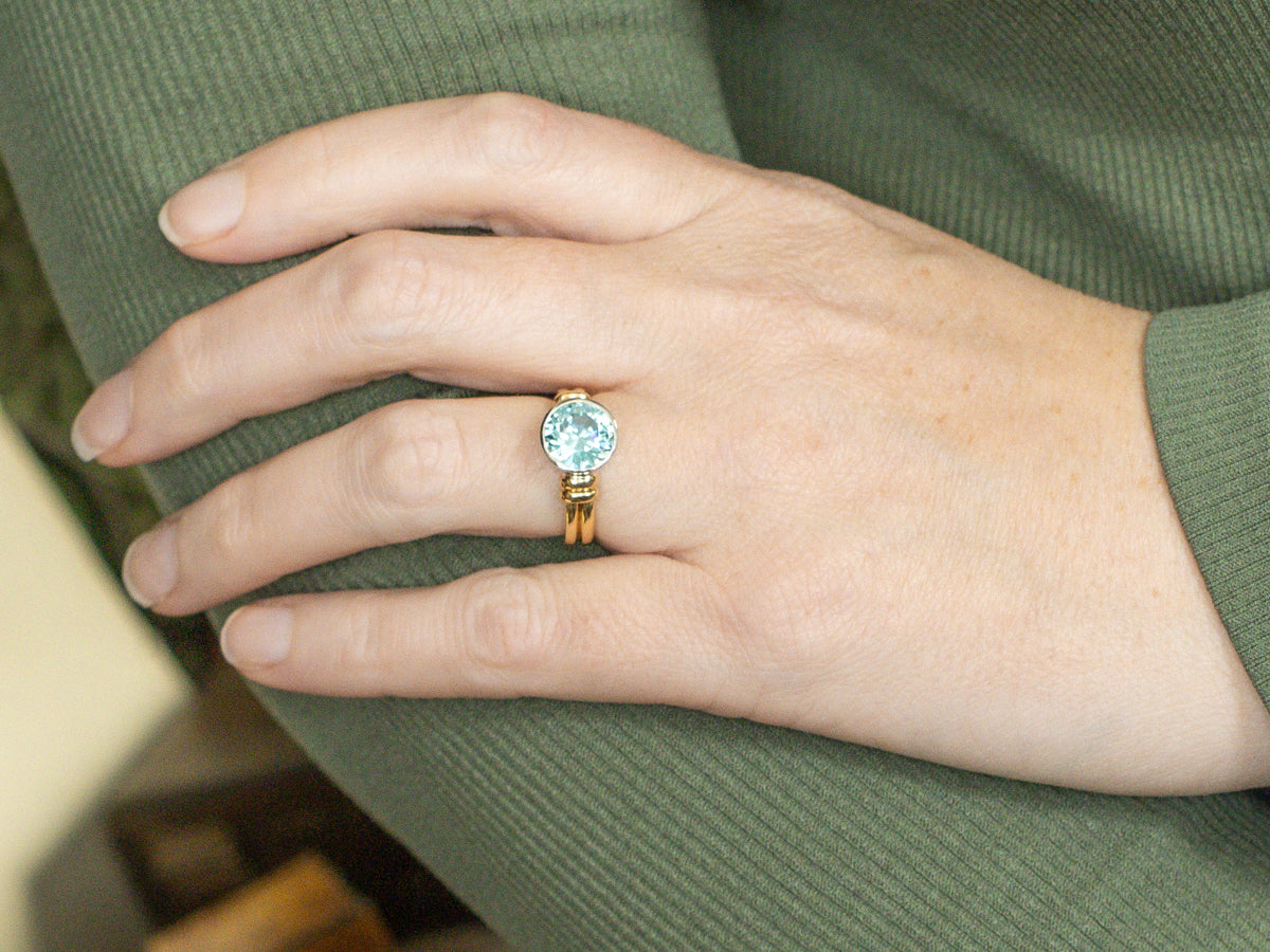 Modern Bezel-Set Platinum and Gold Blue Zircon Solitaire Ring