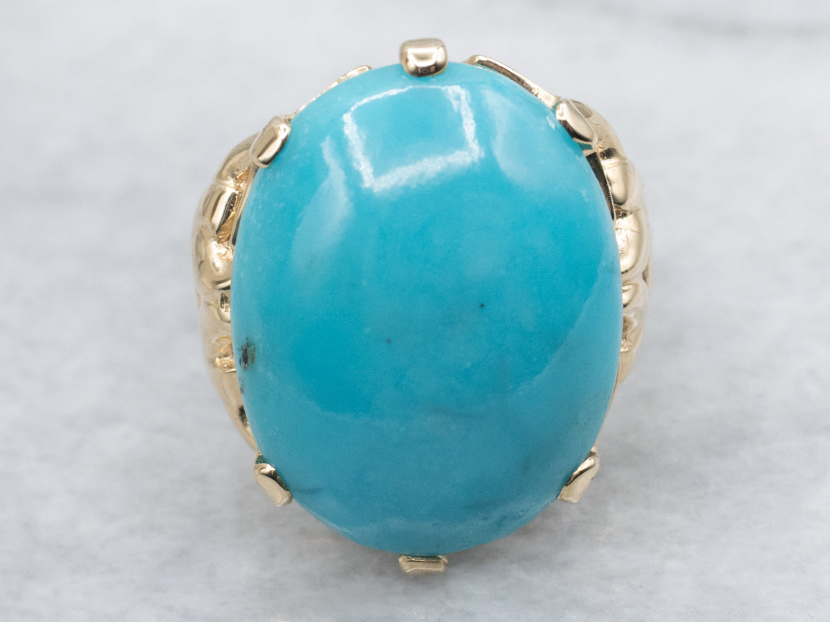 Oval Cut Turquoise Cabochon in Vintage Gold Setting