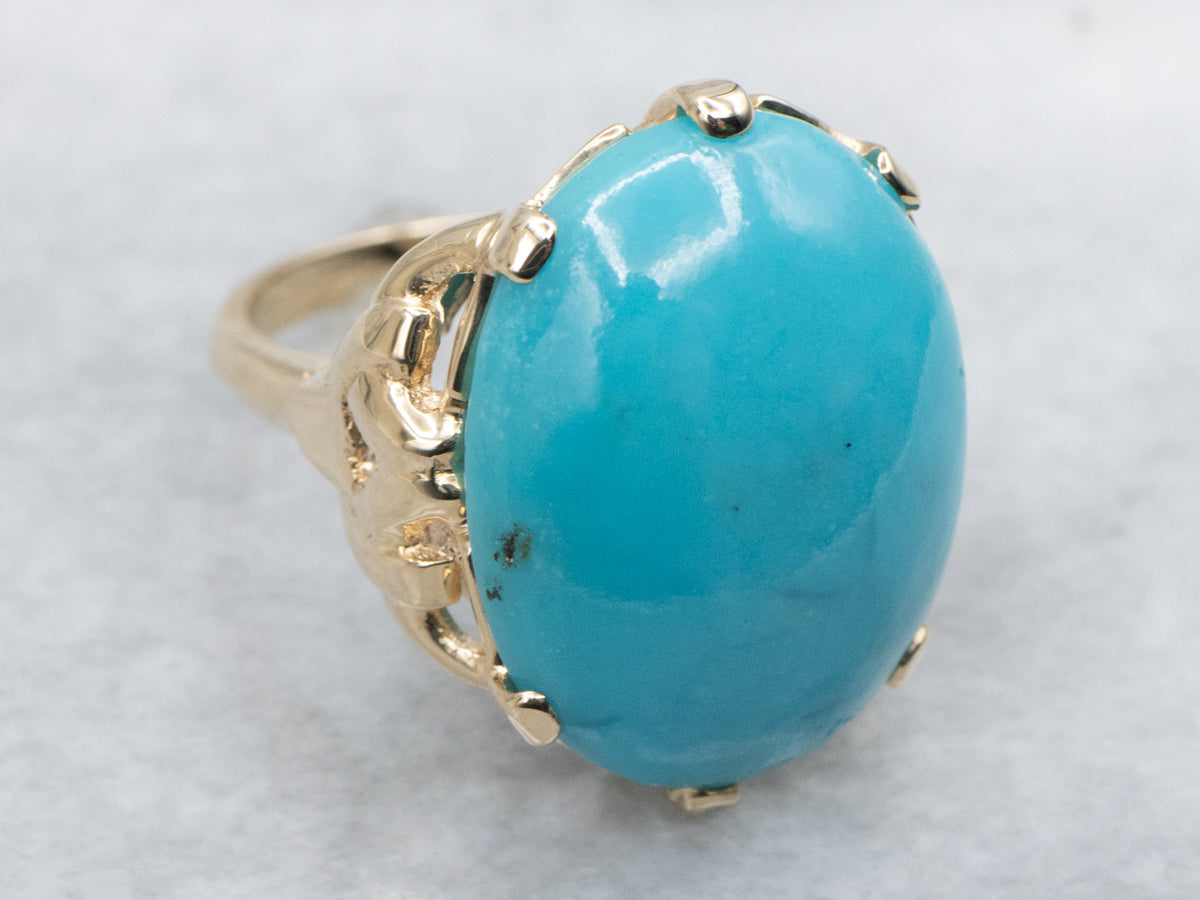 Oval Cut Turquoise Cabochon in Vintage Gold Setting