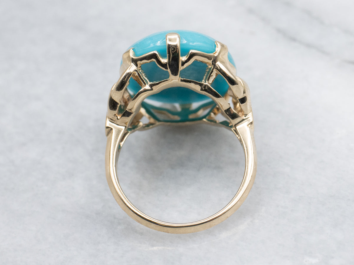Oval Cut Turquoise Cabochon in Vintage Gold Setting
