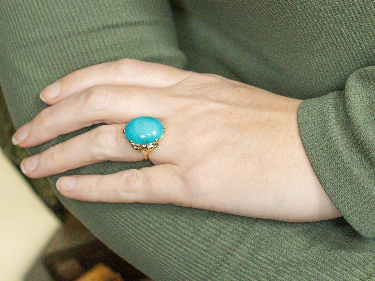 Oval Cut Turquoise Cabochon in Vintage Gold Setting