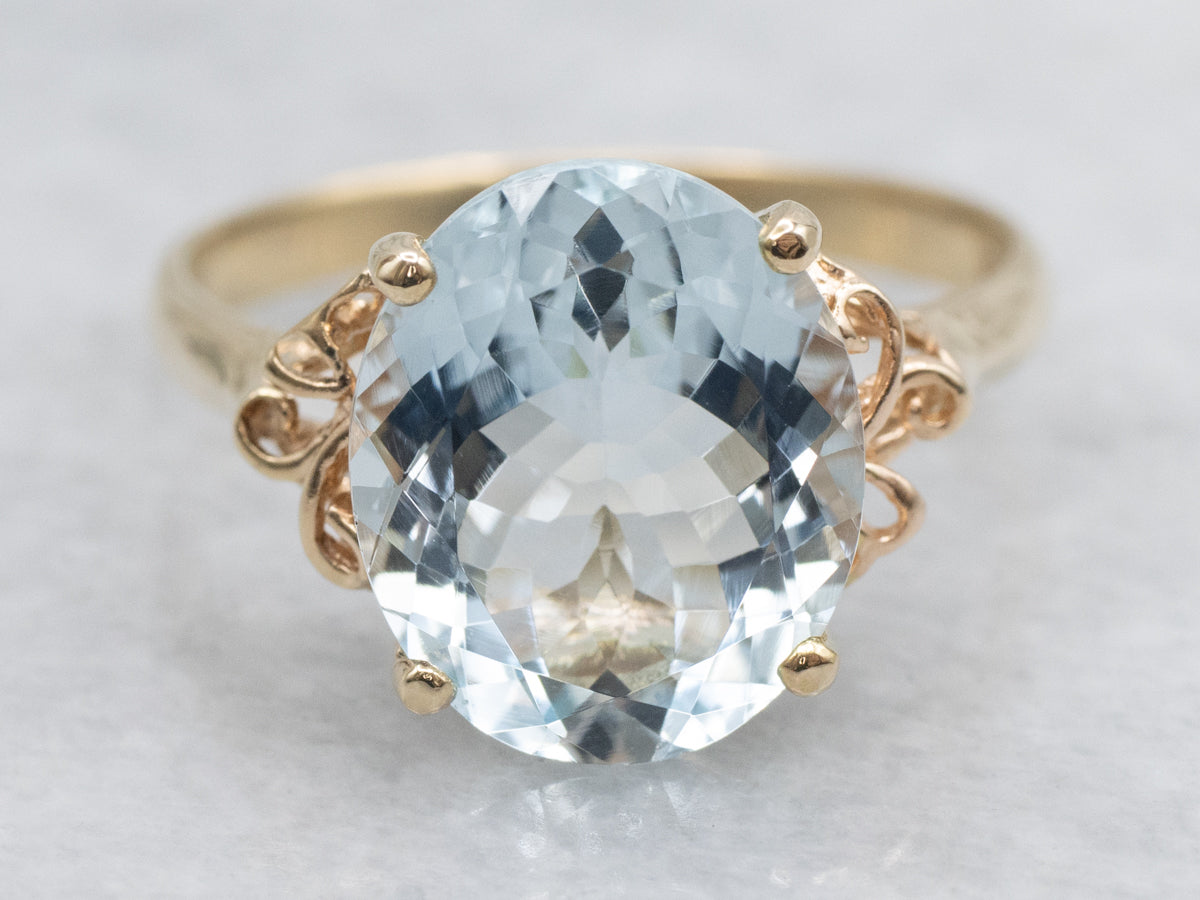 Oval Cut Aquamarine Scrolling Yellow Gold Cocktail Ring