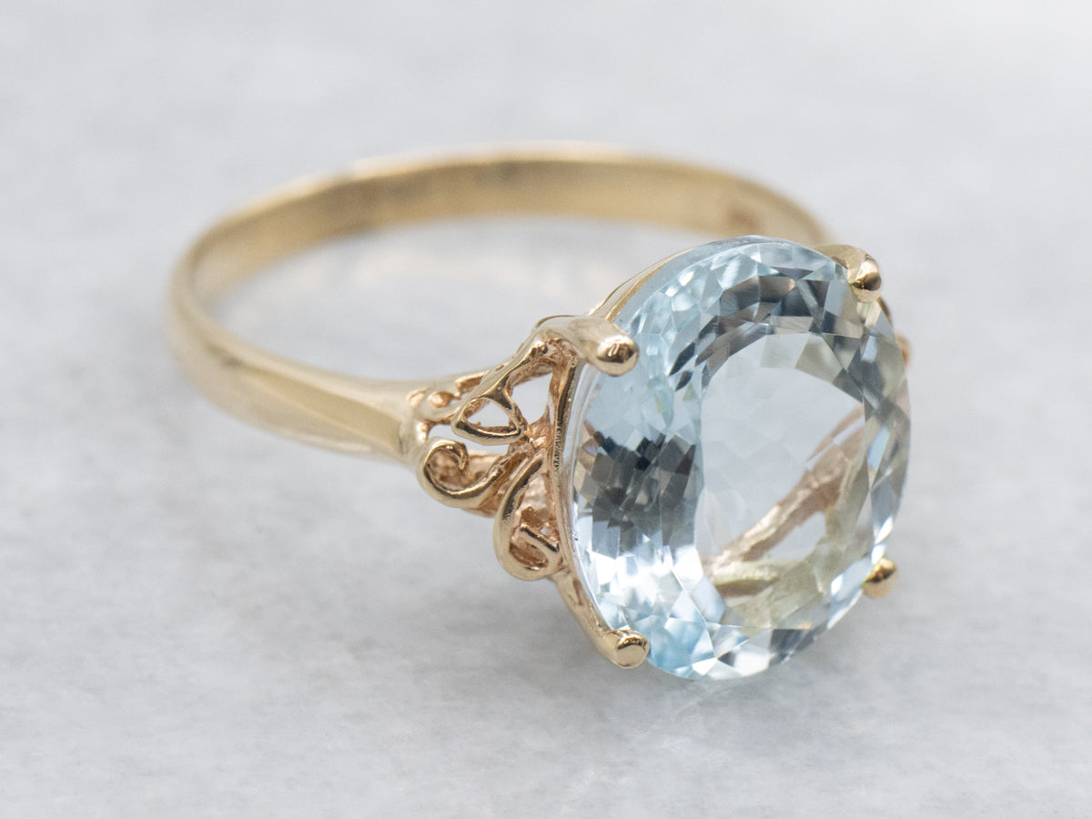 Oval Cut Aquamarine Scrolling Yellow Gold Cocktail Ring