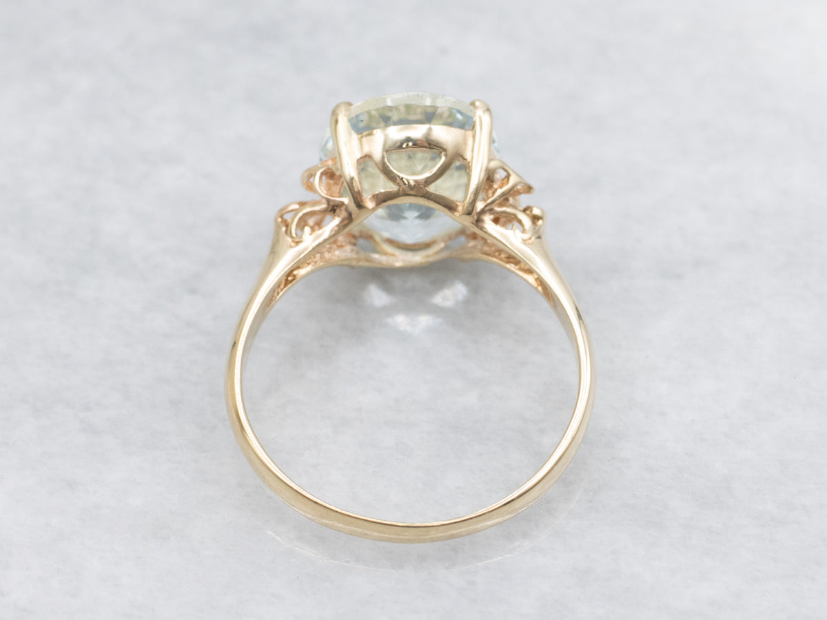 Oval Cut Aquamarine Scrolling Yellow Gold Cocktail Ring