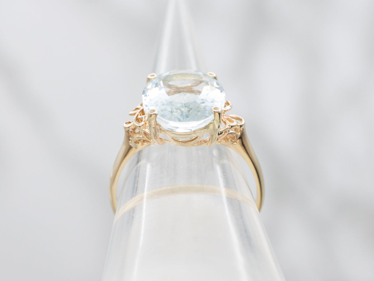 Oval Cut Aquamarine Scrolling Yellow Gold Cocktail Ring