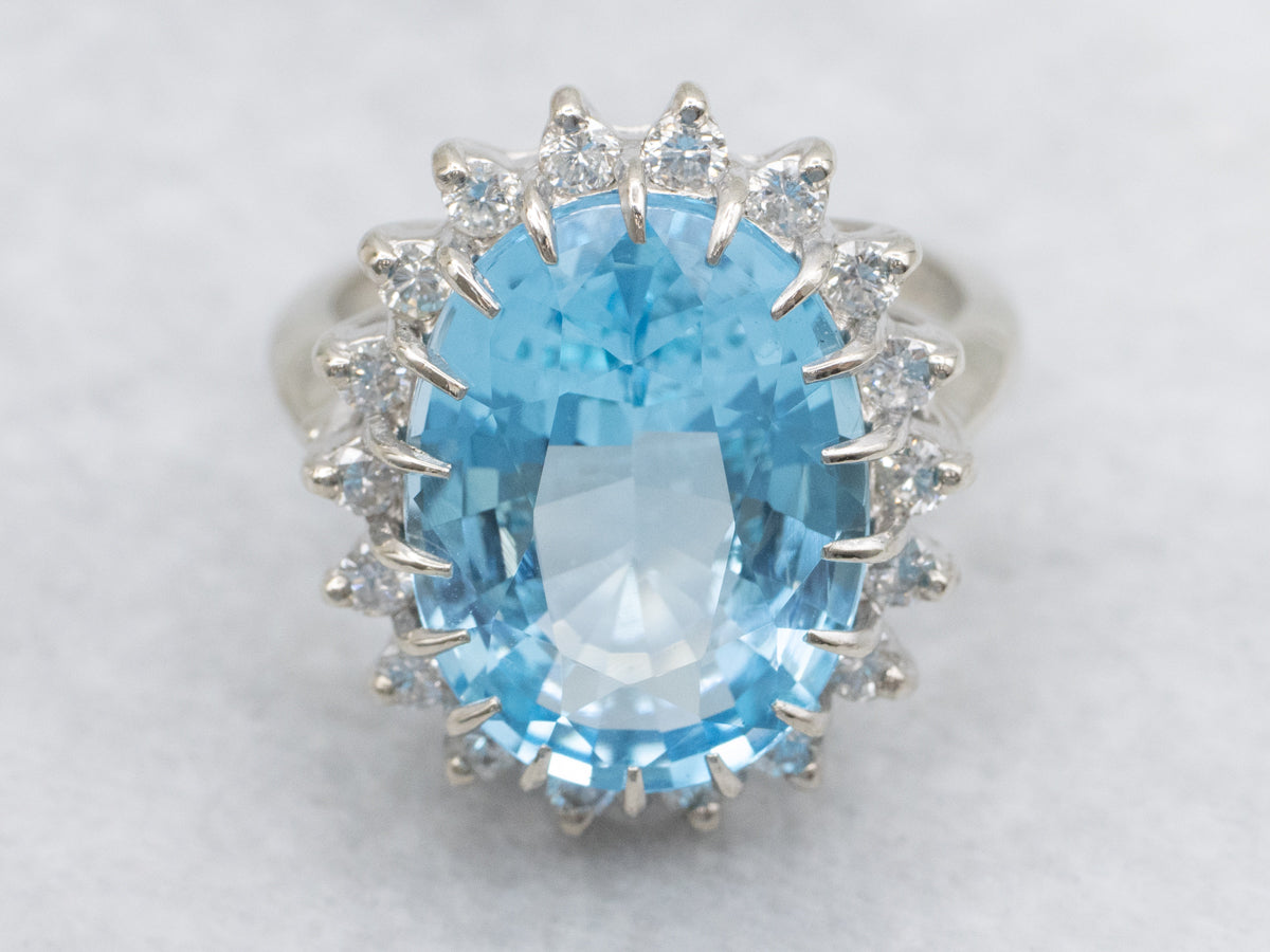 White Gold Blue Topaz and Diamond Halo Cocktail Ring