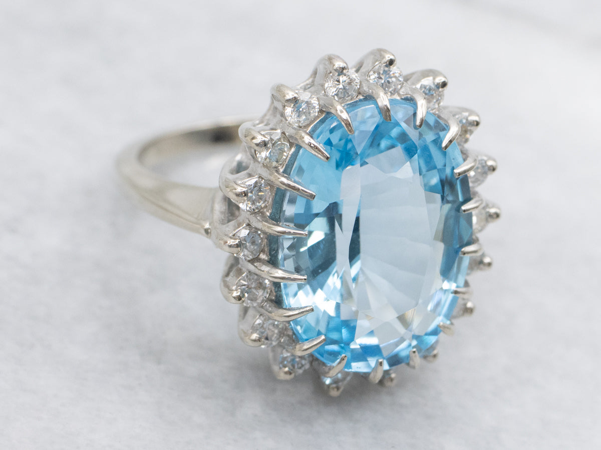 White Gold Blue Topaz and Diamond Halo Cocktail Ring