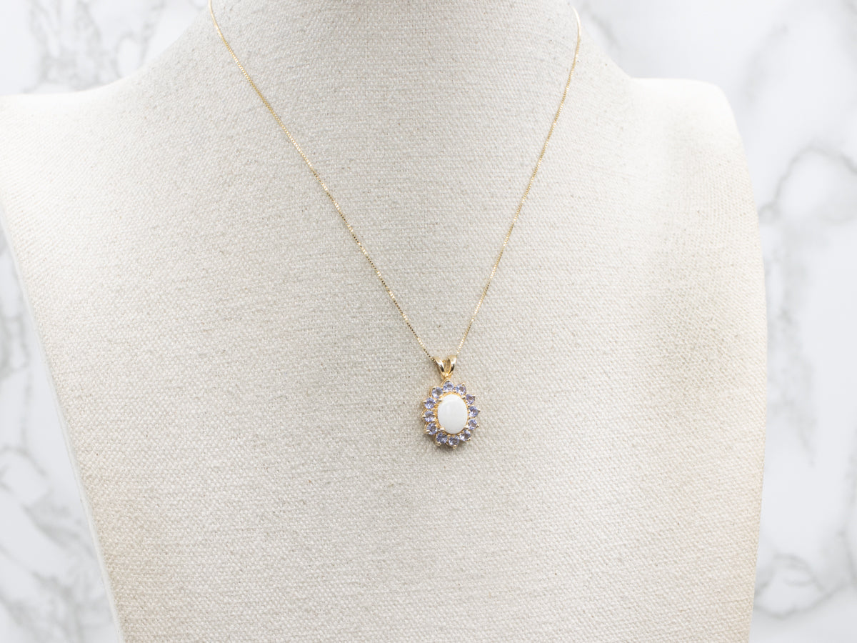 Opal and Tanzanite Gold Halo Pendant
